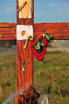 A loving memorial rests in the sun along a back country road