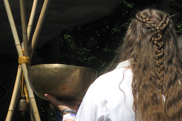 A woman brings the water to the Water Ceremony during the Oregon Country Fair